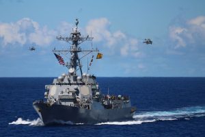 AUKUS submarines: US Navy destroyer and helicopters, Australia's strategic pivot.