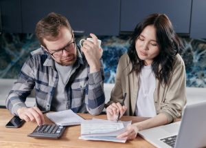 Couple managing budget, finances impacted by government spending.