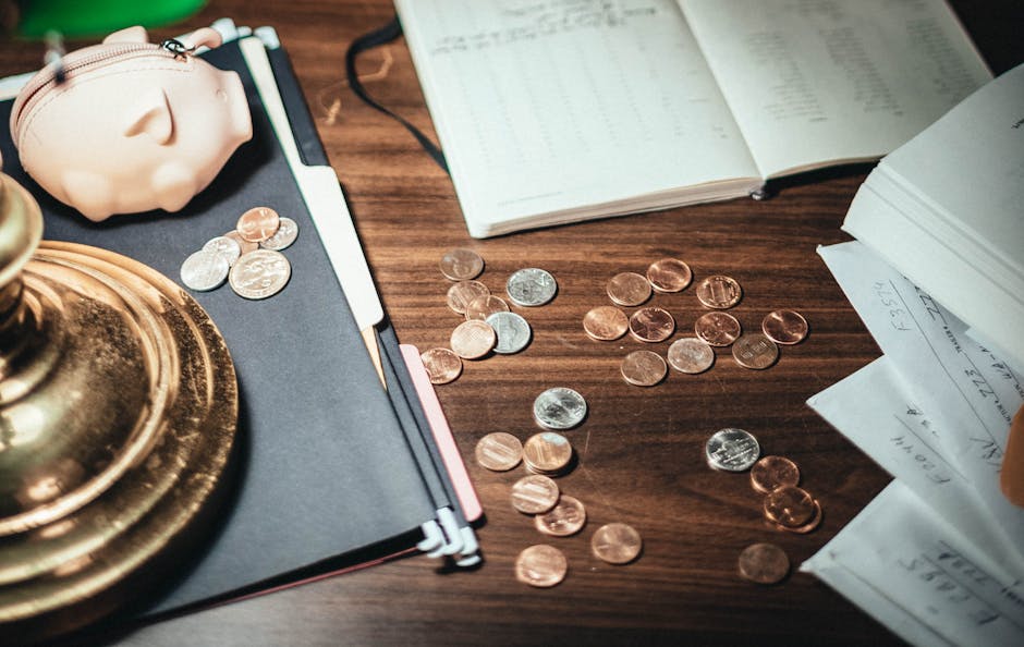 Young Australians face budget changes: coins, pig wallet, financial papers.