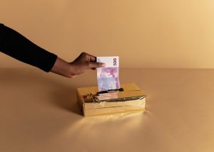 Australian hand holding Euro banknote, symbolizing corruption in labor.