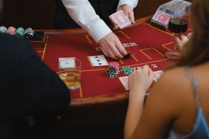 Australian gambling ad opt-out: Casino card table scene with poker chips.