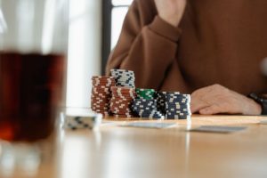 Australian gambling ad reforms: poker chips & cards on table.