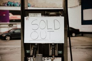 Sydney rental shortage: gas pump 'Sold Out' sign highlights crisis for homeowners.