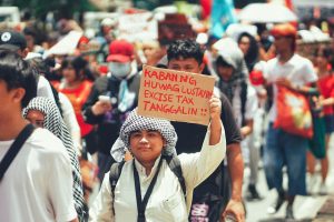 Australian renters march for tax reform impact in urban protest.