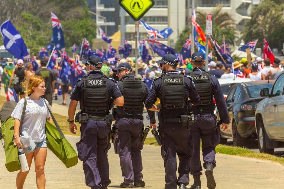 Australian politics: Police at vibrant Australia Day march in Surfers Paradise, showing populism's impact.