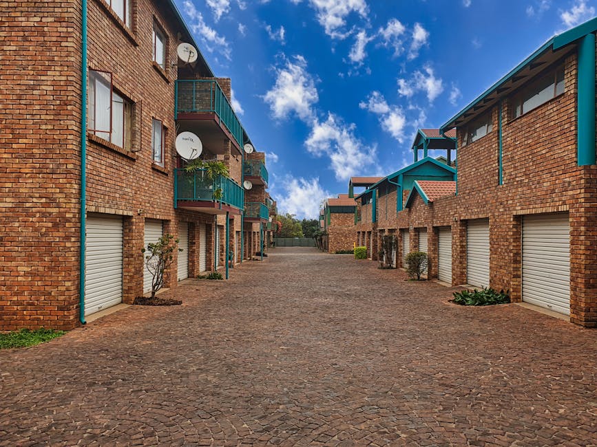 Modern Australian property complex with balconies, garages. Holiday home rule reversal info.
