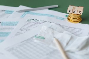 Australian tax return coins stack, budget boost for home deposits, finance